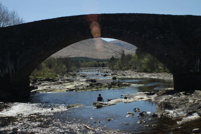 Bridge over river against sky