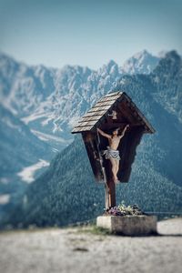 Built structure on land against mountains