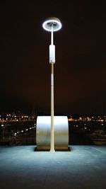 Illuminated street light at night