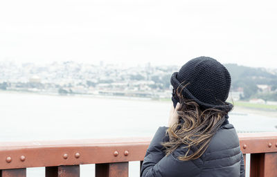 Woman looking at the panorama of the san francisco bay from the golden gate bridge