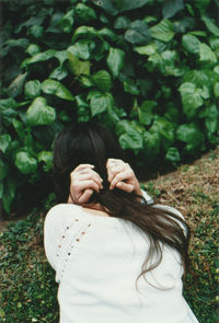 Portrait of young woman in park