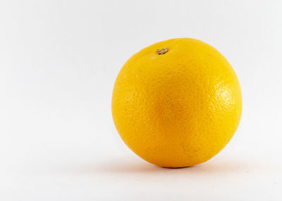 Close-up of oranges against white background