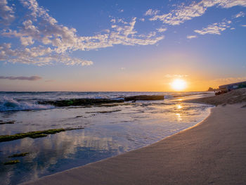 Scenic view of sea against sky during sunset