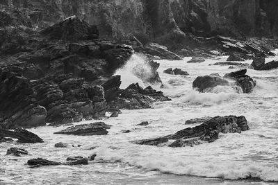 Scenic view of river flowing through rocks