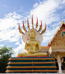 Statue of buddha against sky