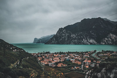 Panoramic view of sea and buildings against sky