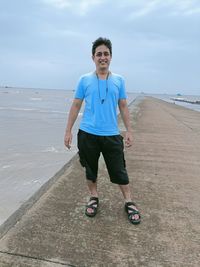 Full length of young man on beach