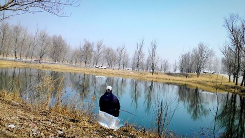 View of calm lake against sky