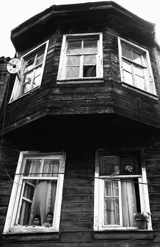 architecture, building exterior, built structure, window, low angle view, building, residential building, residential structure, glass - material, house, sky, facade, day, brick wall, outdoors, no people, city, balcony, exterior, reflection