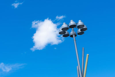 Light pole against blue sky