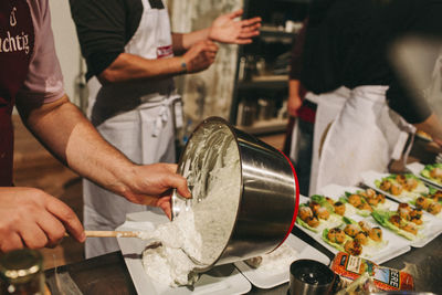 Cropped image of woman holding meat