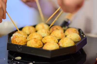 Close-up of person preparing food