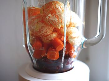 Close-up of fruits in electric juicer