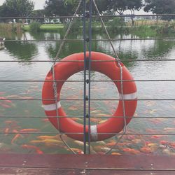 Rope hanging over river against sky