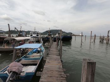 Boats moored at harbor