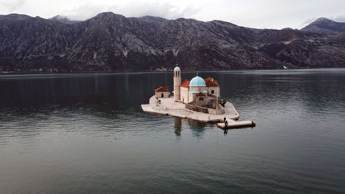 Boat in lake against mountains