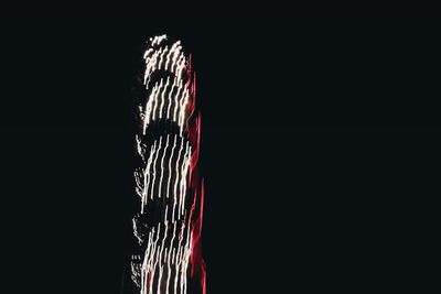 Close-up of rope against black background