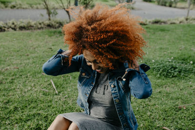 Portrait of hispanic brunette woman with afro