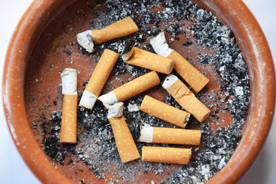 Directly above shot of cigarette in container