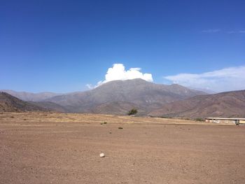 Scenic view of landscape and mountains against sky