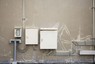 Telephone booth against wall