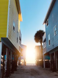 Residential buildings against clear blue sky