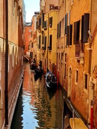 Canal amidst buildings in city