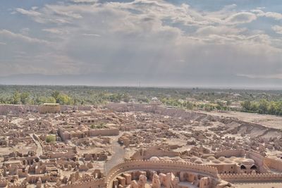 High angle view of town against cloudy sky