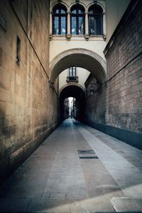 Empty alley along buildings