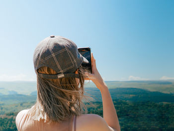 Rear view of woman wearing hat