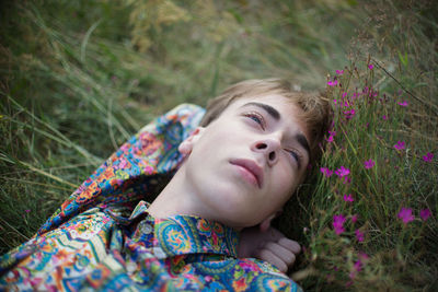 Close-up of man lying on plants