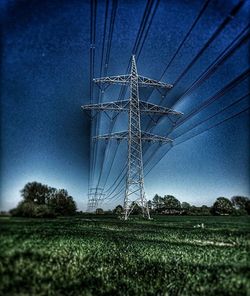 Electricity pylon on field