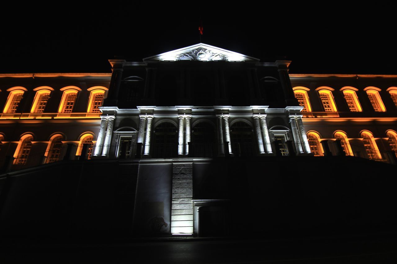 LOW ANGLE VIEW OF ILLUMINATED BUILDING