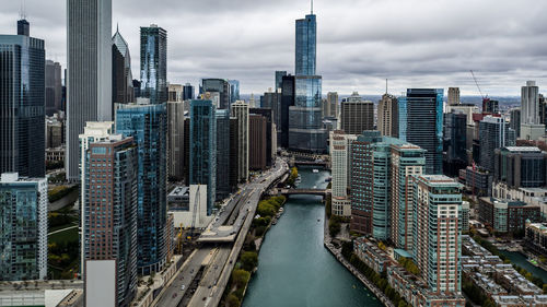 High angle view of cityscape against cloudy sky