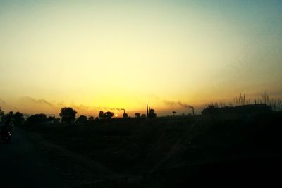 Scenic view of landscape at sunset