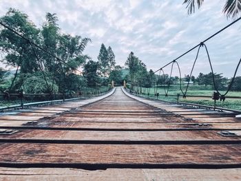 Surface level of railroad tracks against sky