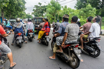 Group of people on road in city