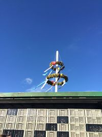 Low angle view of building against blue sky