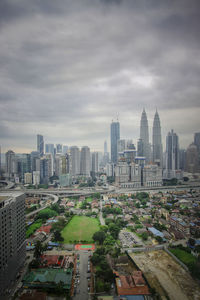 Aerial view of cityscape against sky