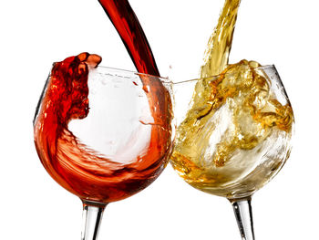 Close-up of beer glass against white background