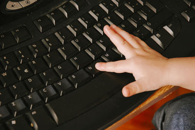 Midsection of person using mobile phone