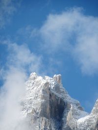 Low angle view of snowcapped mountain against sky