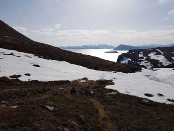 Scenic view of snowcapped mountains against sky