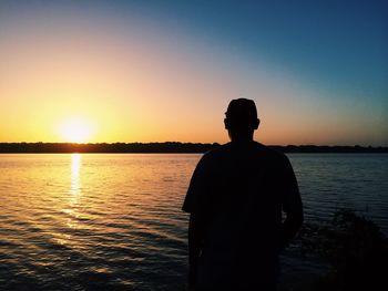 Silhouette of people at sunset