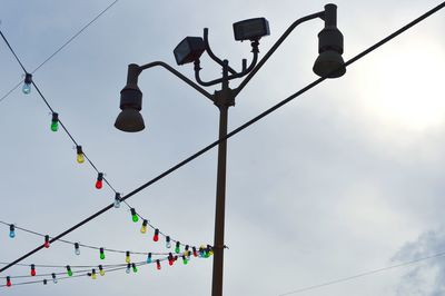 Low angle view of street light against sky