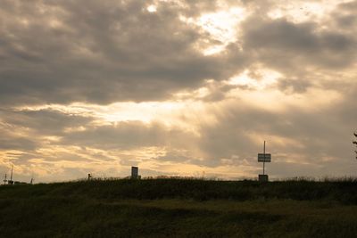 Scenic view of field against sky during sunset