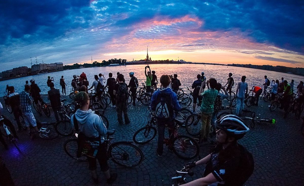 sky, men, cloud - sky, lifestyles, leisure activity, bicycle, person, transportation, sunset, travel, water, large group of people, silhouette, cloud, mode of transport, tourism, land vehicle, travel destinations, tourist