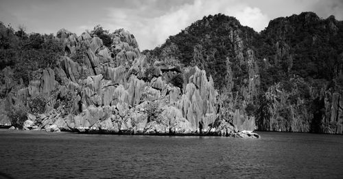 Scenic view of sea and rocks against sky