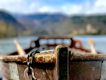 Close-up of wooden row boat on lake