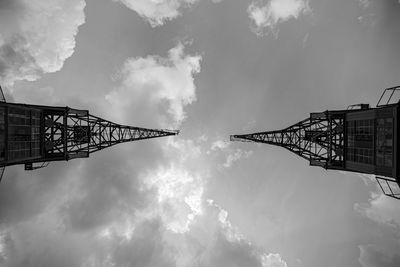 Low angle view of crane against sky